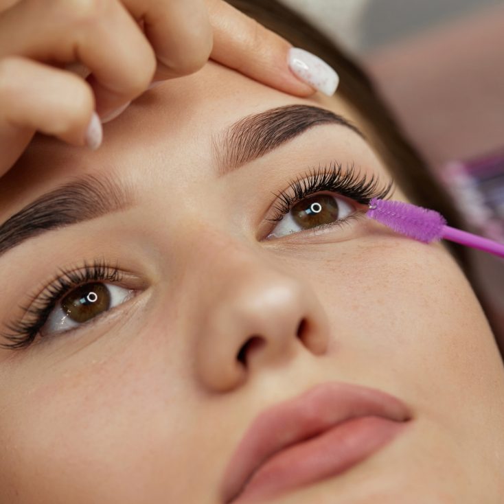 All About Eyelash Extension Glue for Sensitive Eyes: Choosing the Best Hypoallergenic Lash Glue Client with sensitive eyes showing off fresh lash extensions