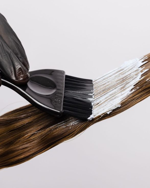 Bleaching hair process. Same as bleaching black synthetic fibers to make matte colored lashes